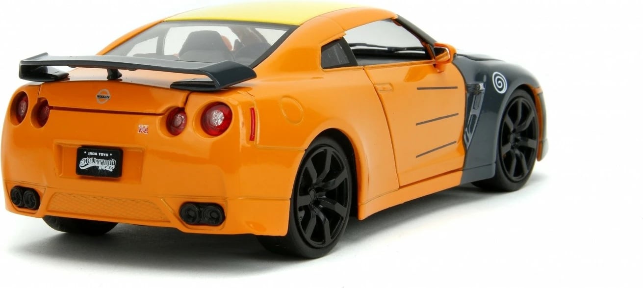 Makine lodër Jada Toys Naruto Shippuden Nissan GT-R 1:24 me figurë Naruto, portokalli/zezë Makine lodër Jada Toys Naruto Shippuden Nissan GT-R 1:24 me figurë Naruto, portokalli/zezë