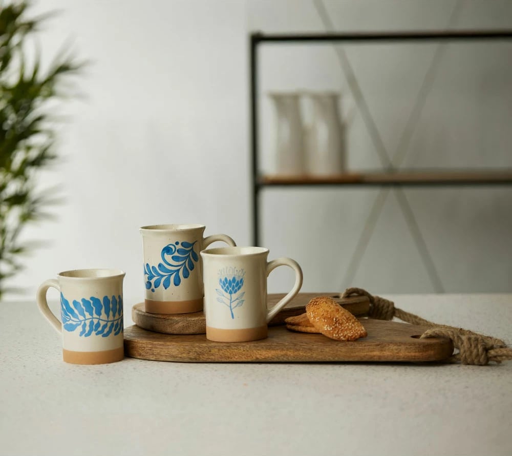 Filxhan Ydra, gur qeramike, i bardhë, detaje blu të çelët, bezhë, 10x10x12cm Filxhan Ydra, gur qeramike, i bardhë, detaje blu të çelët, bezhë, 10x10x12cm