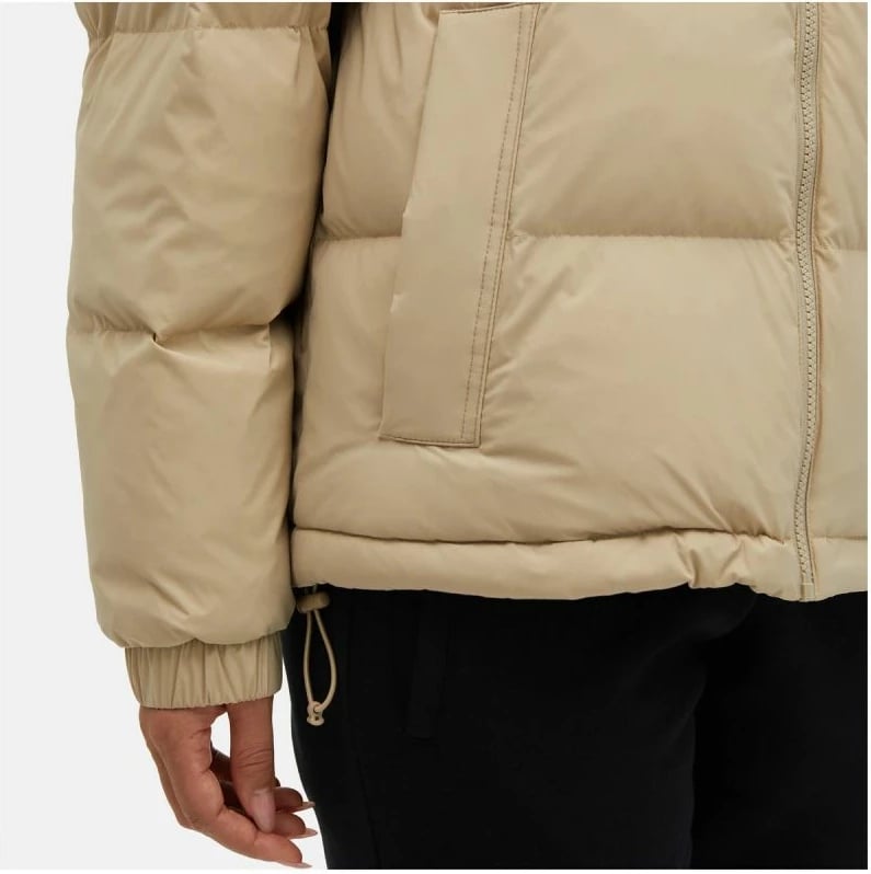 Jakne New Balance femra, bezhë