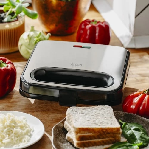 Toster për sanduiçe Adler AD 3076, pllaka trekëndëshe jo-ngjitëse, 750W (max 1000W), 2 drita treguese, argjendtë/zi Toster për sanduiçe Adler AD 3076, pllaka trekëndëshe jo-ngjitëse, 750W (max 1000W), 2 drita treguese, argjendtë/zi