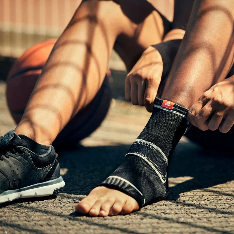 Shirit stabilizues kyçi adidas, uniseks, të zi